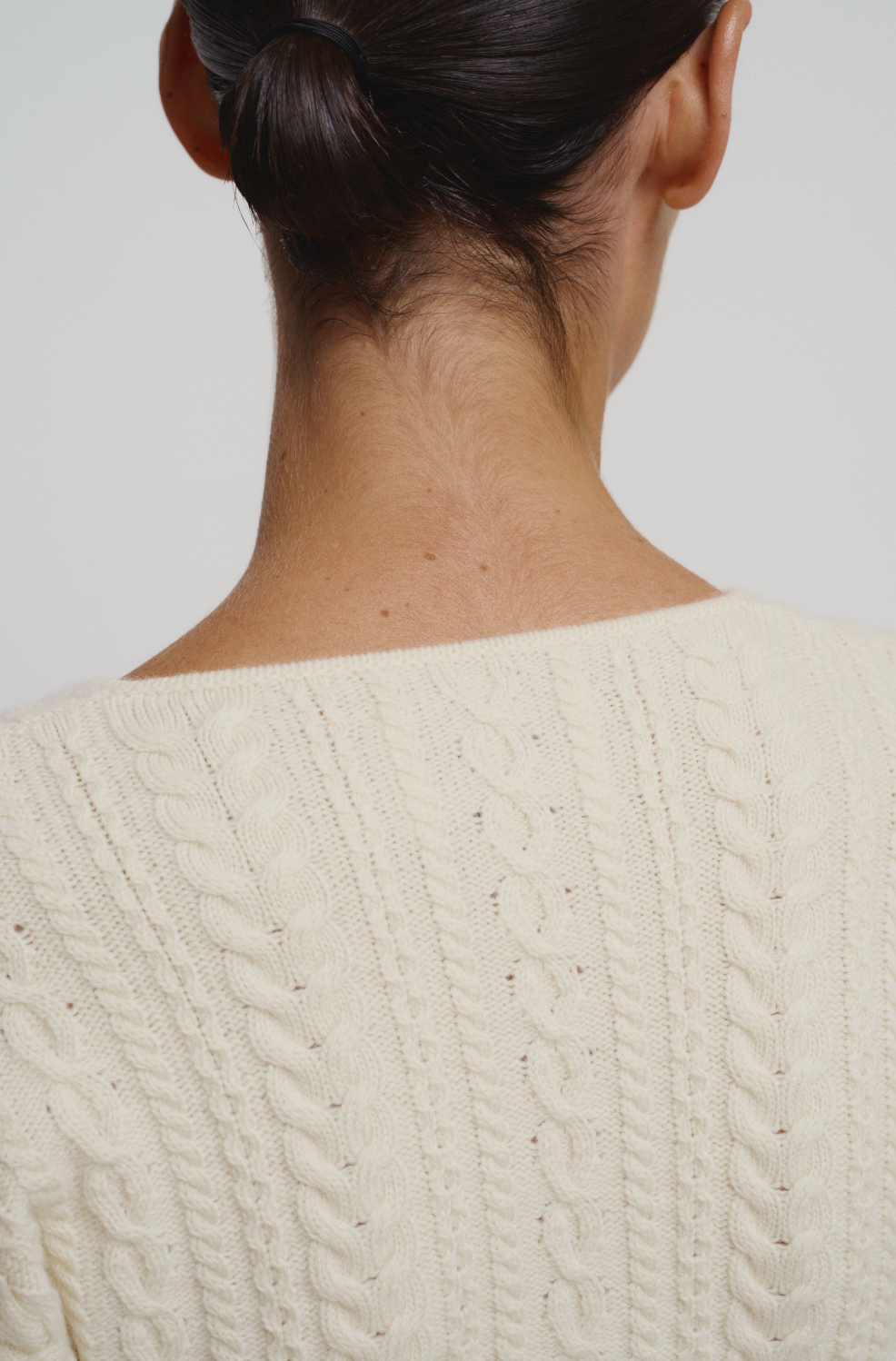 Cable knit corseted cardigan