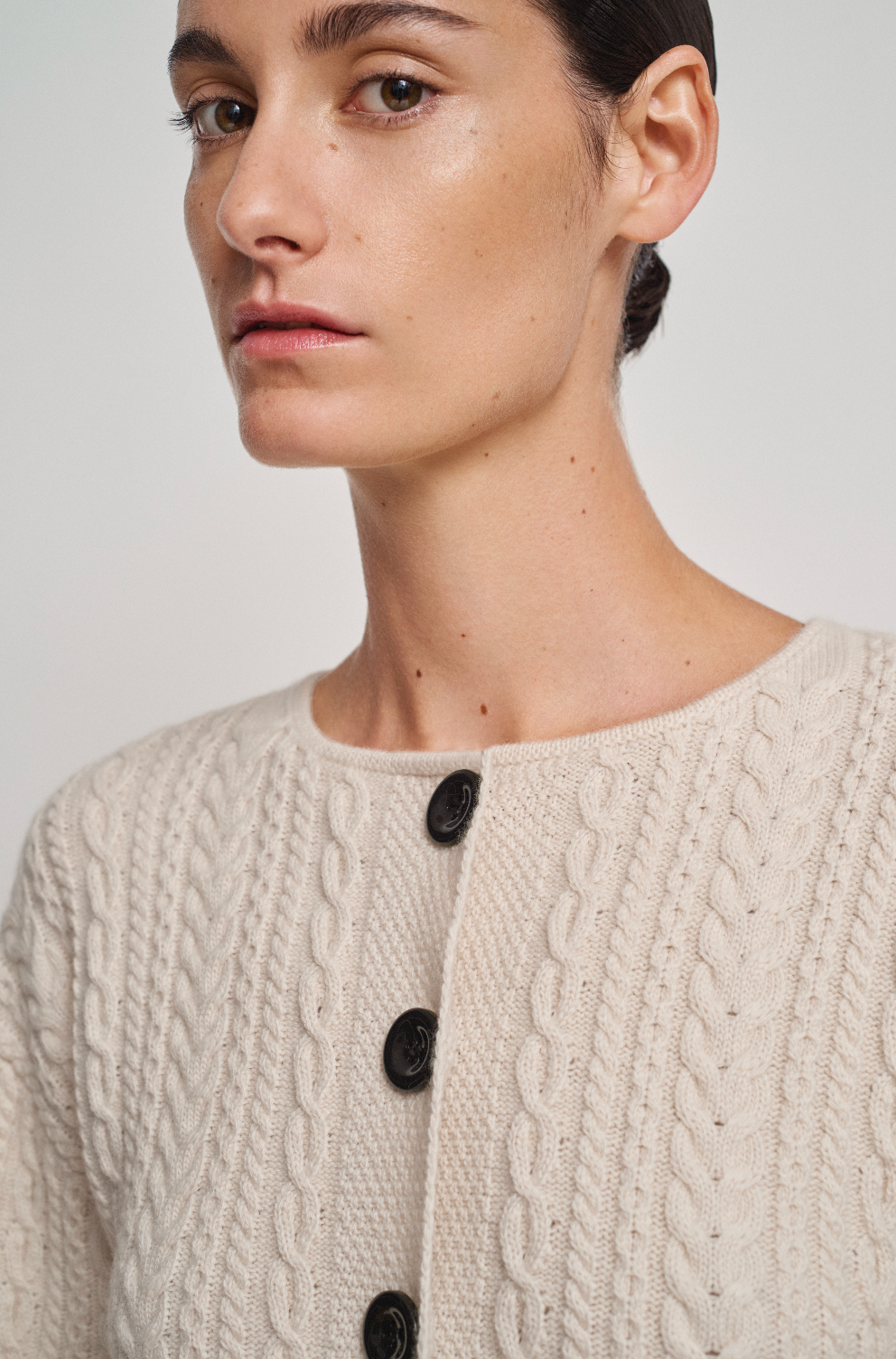 Cable knit corseted cardigan